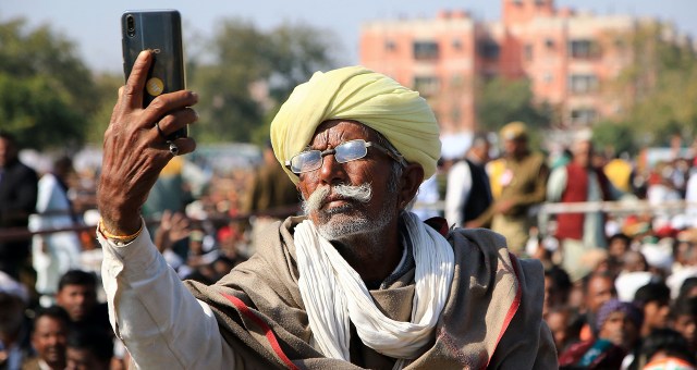 A farmer takes a selfie with a smartphone at a rally in Jaipur, India. (Vishal Bhatnagar/AFP/Getty Images)