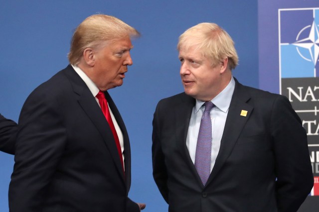 U.S. President Donald Trump talks with British Prime Minister Boris Johnson at the annual NATO summit of heads of government on Dec. 4, 2019, in Watford, England. (Steve Parsons-WPA Pool/Getty Images)