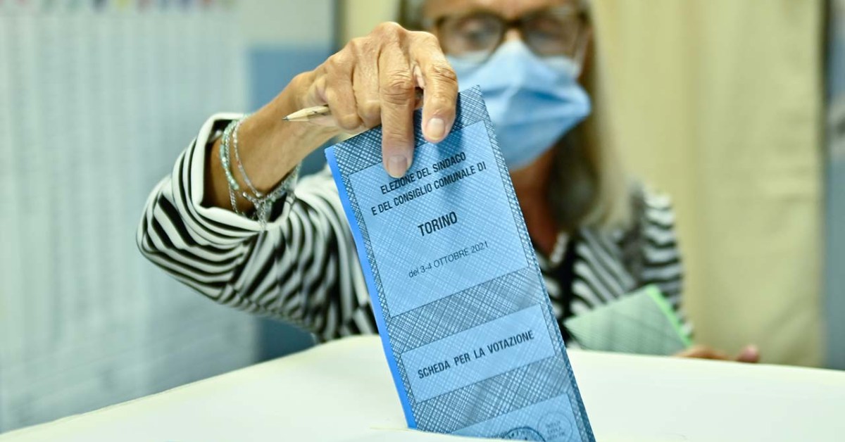 A woman votes at a polling station on Oct. 4, 2021, in Turin, Italy. (Stefano Guidi/Getty Images)