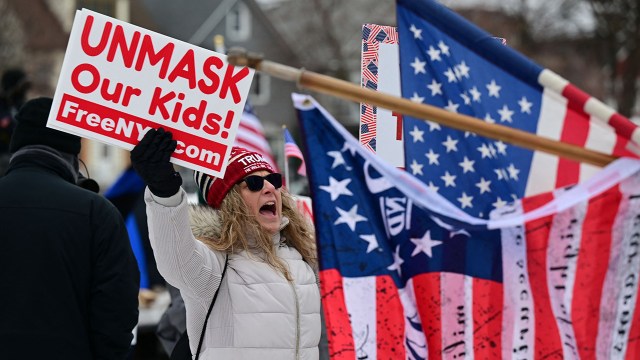 Photo showing protestors gather in Buffalo, New York, in response to requirements that truck drivers be vaccinated for COVID-19 before entering Canada from the U.S., on Feb. 12, 2022. (Dustin Franz/AFP via Getty Images)