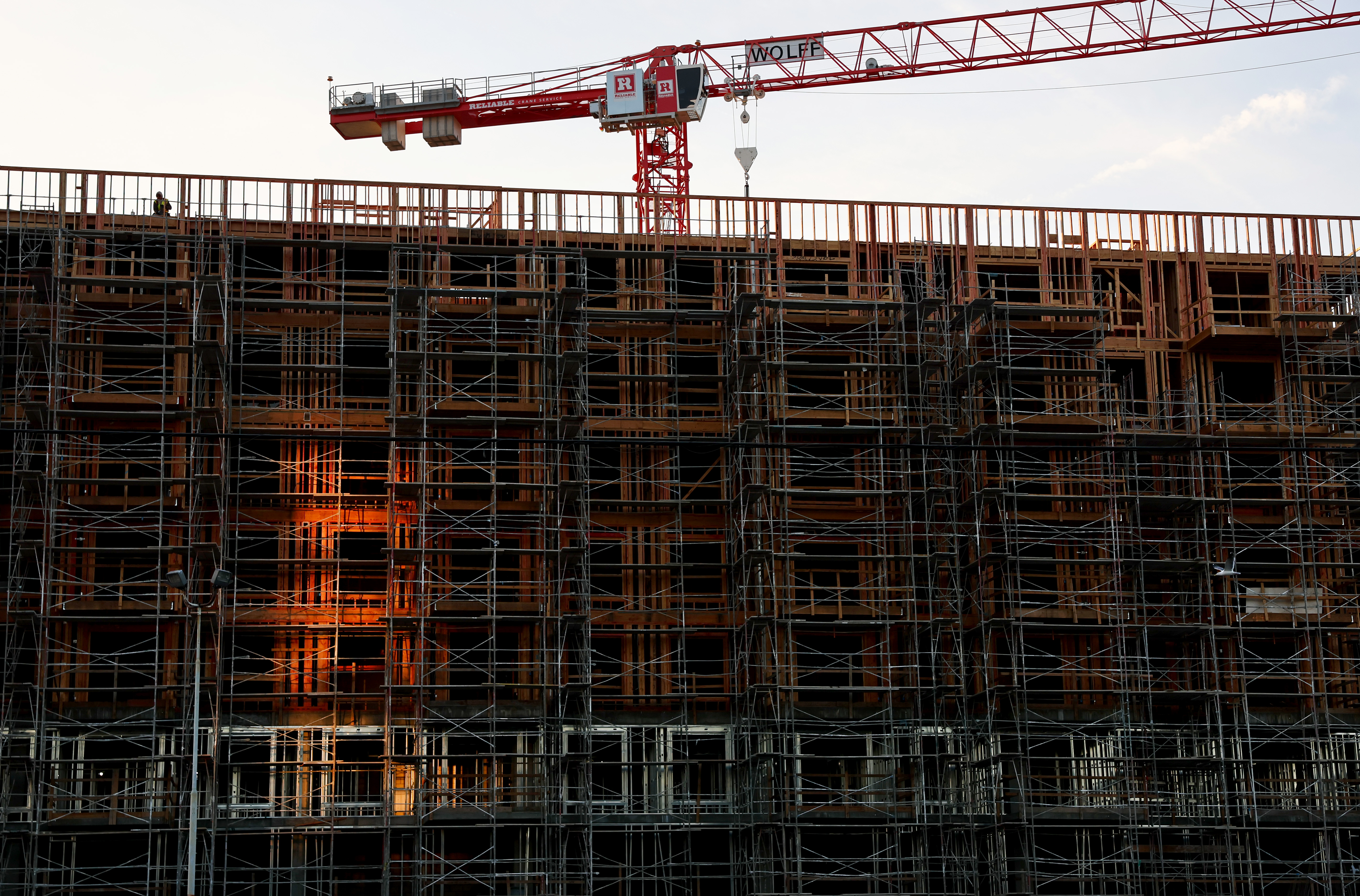A crane is positioned above new residential housing units under construction on Dec. 19, 2022, in Los Angeles. (Mario Tama/Getty Images)
