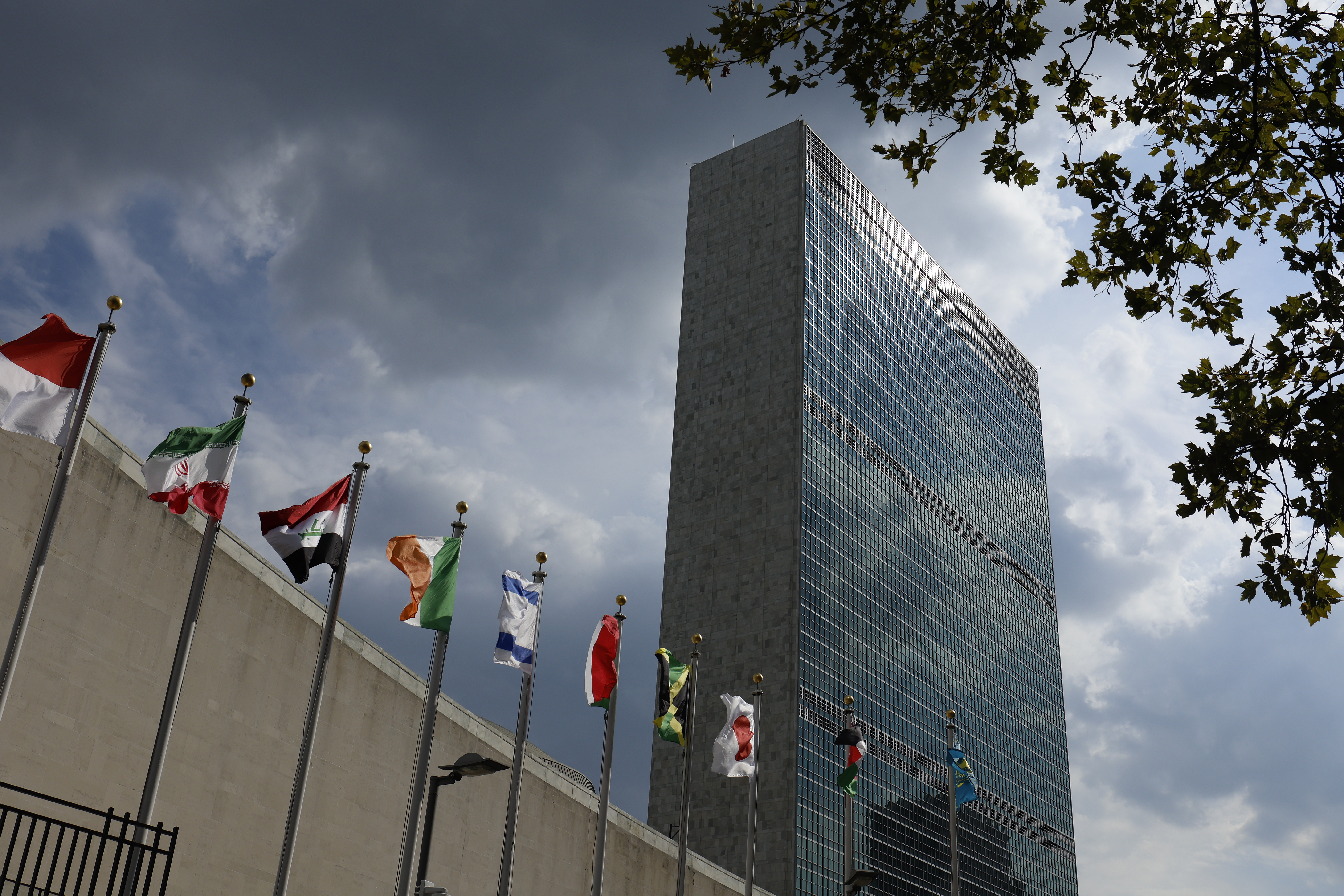 The United Nations headquarters building stands behind world flags on Sept. 19, 2022, in New York City. (Anna Moneymaker/Getty Images)