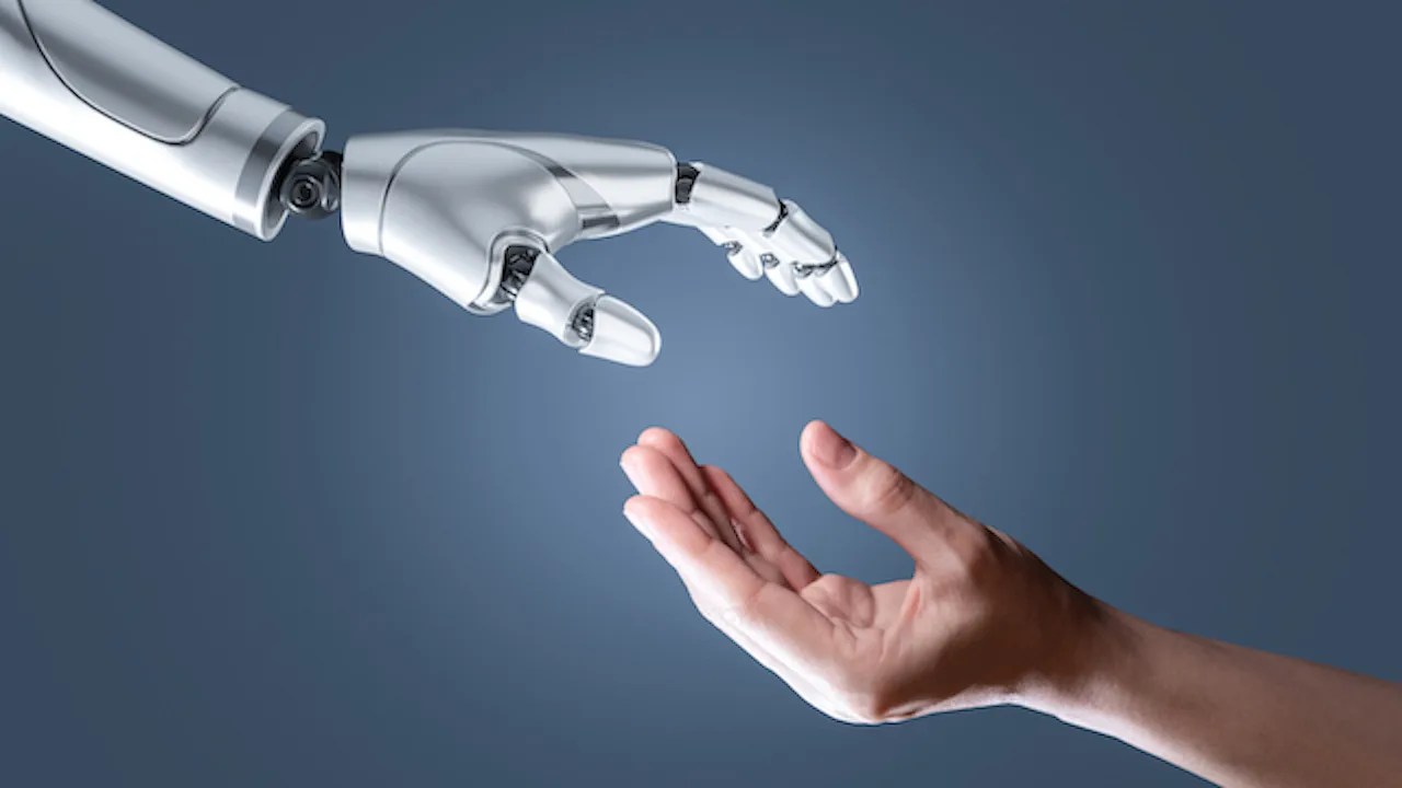 An image of Artificial intelligence robot hand and human hand