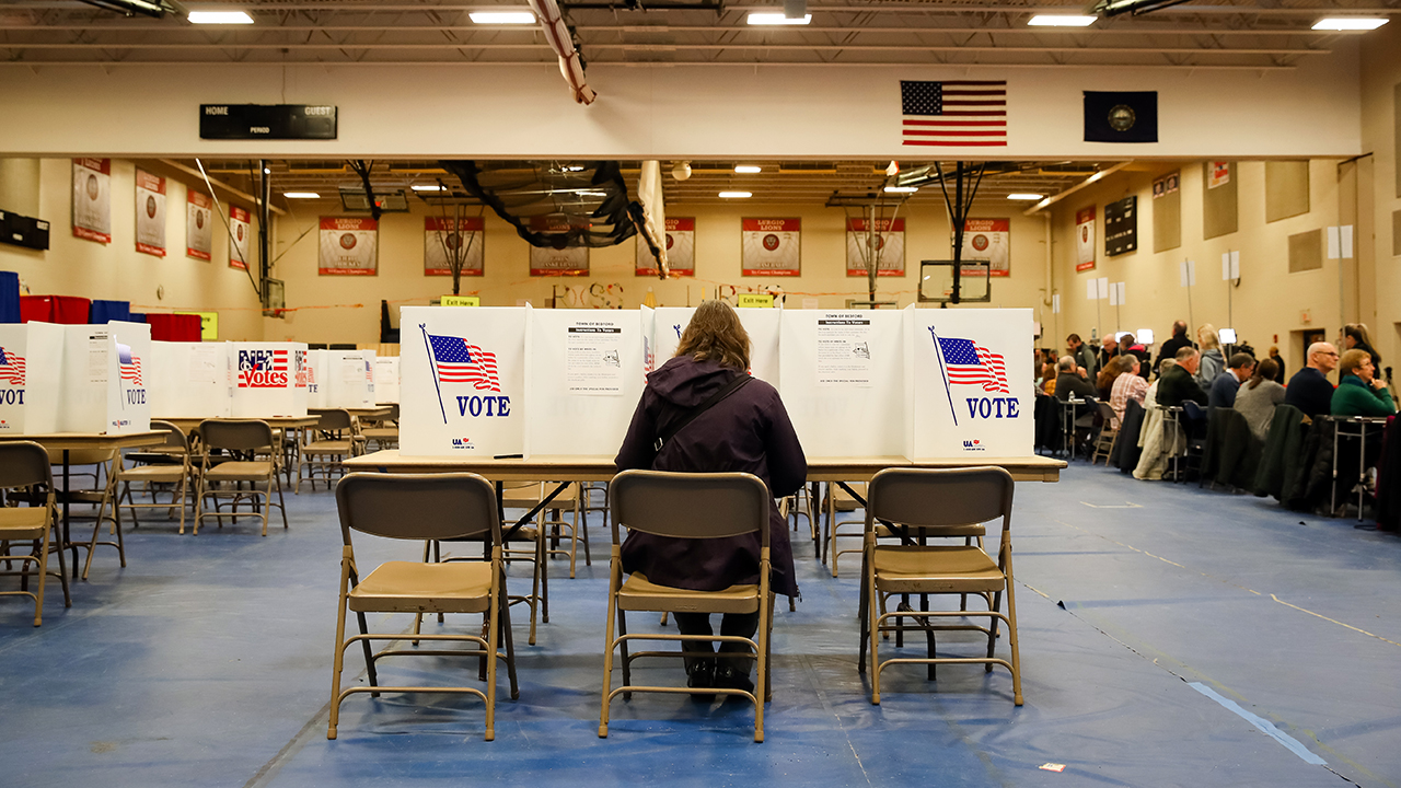 A voter casts a ballot in Bedford, New Hampshire, for the state's primary on Feb. 11. (Matthew Cavanaugh/Getty Images)