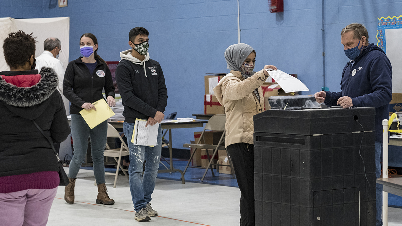 A first-time voter casts her ballot on Election Day in Manchester, New Hampshire. (Jodi Hilton/NurPhoto via Getty Images)