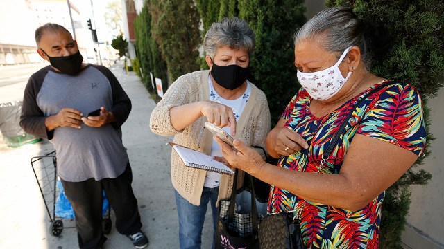 Participants prepare for COVID-19 testing outside the Mexican Consulate in Los Angeles in August 2020. (Al Seib/Los Angeles Times via Getty Images)