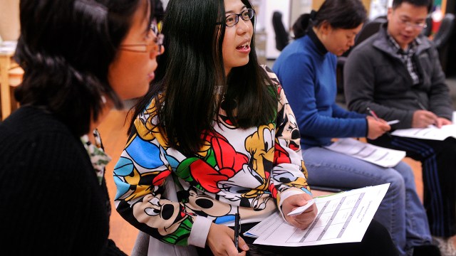 Foreign-born students practice English pronunciation as part of an ESL program through Intercambio: Uniting Communities in Boulder, Colorado, in 2013. (Karl Gehring/The Denver Post via Getty Images)