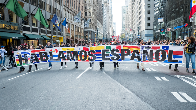 Marchers carry a banner down Fifth Avenue in Manhattan reading "We Speak Spanish" for New York City's annual Hispanic Heritage Day Parade in October 2019. (Ira L. Black/Corbis via Getty Images)