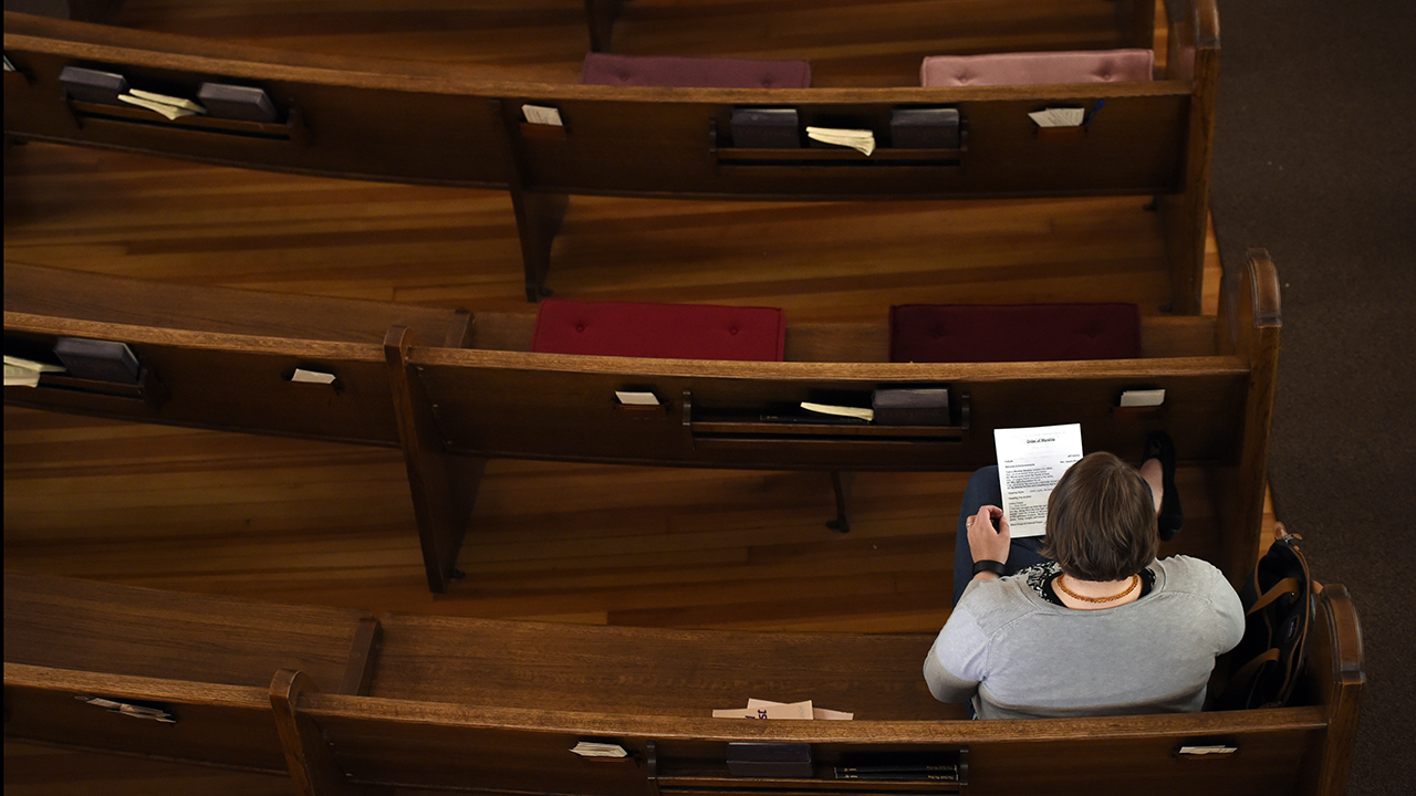 A parishioner sits in a pew at St. Paul's Methodist Church in Denver in 2016. (John Leyba/The Denver Post/Getty Images)