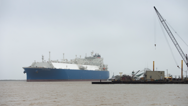 Photo shows a liquified natural gas tanker make its way into Cameron Pass, Louisiana, near a gas-exporting facility that is undergoing expansion, in April 2022. 