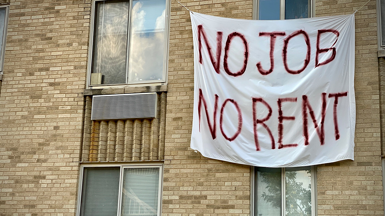 A banner against renters eviction reading no job, no rent is displayed on a controlled rent building in Washington, DC. (Eric Baradat/Getty Images)