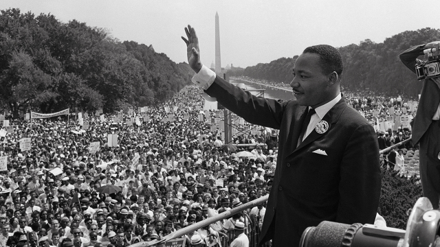 Martin Luther King Jr. waves to civil rights supporters in Washington, D.C., during the March on Washington for Jobs and Freedom, where King delivered his "I Have a Dream" speech on Aug. 28, 1963. (AFP via Getty Images)