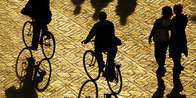 People at Djemaa el-Fna Square, late afternoon sun