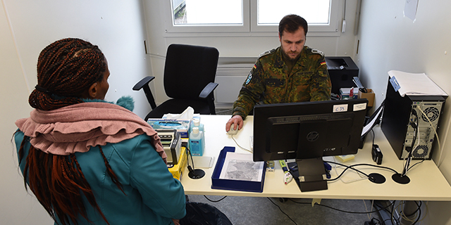 A migrant waits at a police registration point for asylum seekers in Erding, Germany, on Nov, 15, 2016. (Christof Stache/AFP/Getty Images)