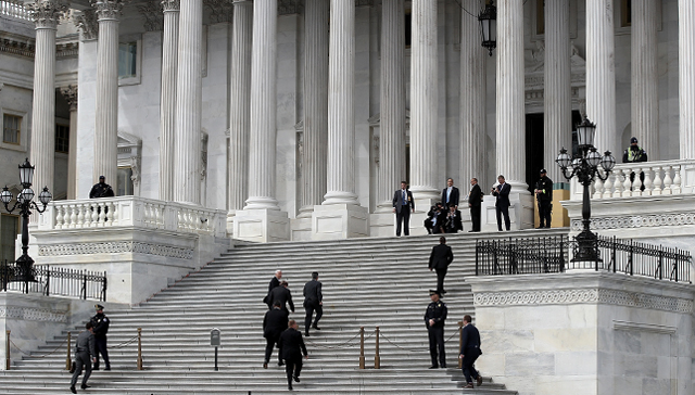 Vice President Mike Pence and his entourage arrive on the steps of the U.S. Senate to preside over Supreme Court nominee Neil Gorsuch's confirmation vote on April 7. Gorsuch was confirmed after the Senate changed its rules to permit cloture to be invoked against Supreme Court filibusters by simple majority vote. (Win McNamee/Getty Images)