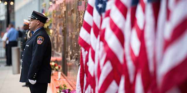 A firefighter stands outside the FDNY Engine 10, Ladder 10 station near the September 11 Memorial site in New York City on Sept. 11, 2016. Services were being held to remember the 2,977 people who were killed in the 9/11 attacks in New York, the Pentagon and rural Pennsylvania. (Drew Angerer/Getty Images)