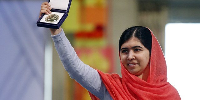 Nobel Peace Prize laureate Malala Yousafzai displays her medal during the Nobel Peace Prize awards ceremony in Oslo on Dec. 10, 2014. (Cornelius Poppe/AFP/Getty Images)
