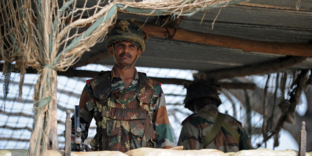 Indian soldiers take up position at an outpost on the India-Pakistan border in R.S. Pora, southwest of Jammu, on Oct. 2, 2016. (Tauseef Mustafa/AFP/Getty Images)