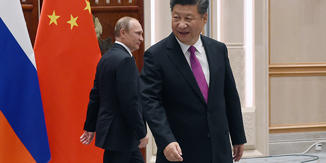 Chinese President Xi Jinping, foreground, with Russian President Vladimir Putin in Hangzhou, China, in September 2016 as world leaders assembled for the 11th G20 Summit. (Wang Zhou - Pool/Getty Images)