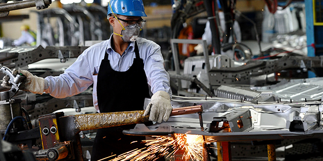 A worker welds at the Ford automotive plant in the northern province of Hai Duong, Vietnam, in January 2017. (Hoang Dinh Nam/AFP/Getty Images)