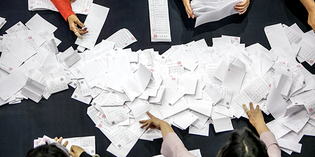 Officials in Seoul, South Korea, count ballots from the May 2017 presidential election.