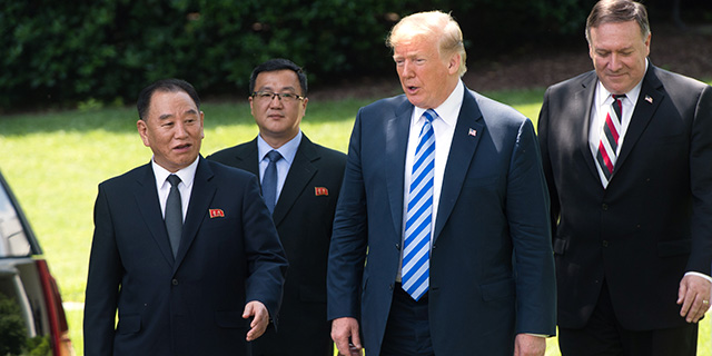 U.S. President Donald Trump speaks with Kim Yong Chol (left), vice chairman of the North Korean ruling party's central committee, on the South Lawn of the White House on June 1 in Washington, D.C., as Secretary of State Mike Pompeo looks on. (Saul Loeb/AFP/Getty Images)
