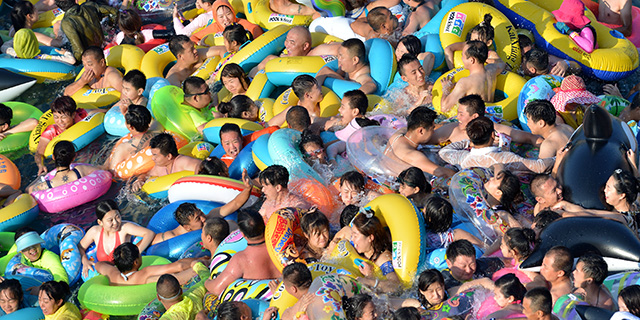 People shown at a water park in China in 2017. China has the world’s largest population, but is projected to slide down to second place in the global population ranking in 2023. 