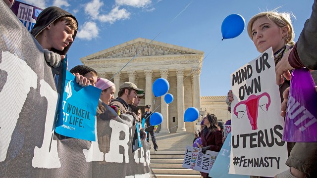 Abortion-rights advocates (right) and anti-abortion advocates (left) rally outside of the Supreme Court in 2016. (Drew Angerer/Getty Images)