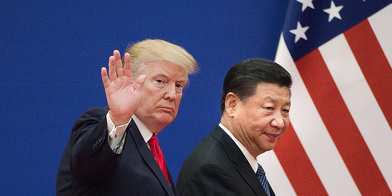 Presidents Trump and Xi leave a business leaders event at the Great Hall of the People in Beijing in November 2017. (Nicolas Asfouri/AFP via Getty Images)