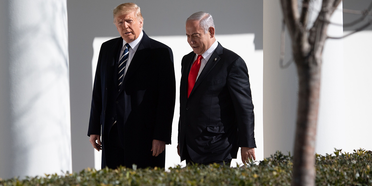 US President Donald Trump walks with Israeli Prime Minister Benjamin Netanyahu at the White House in Washington, D.C., last month. (Saul Loeb/AFP via Getty Images)