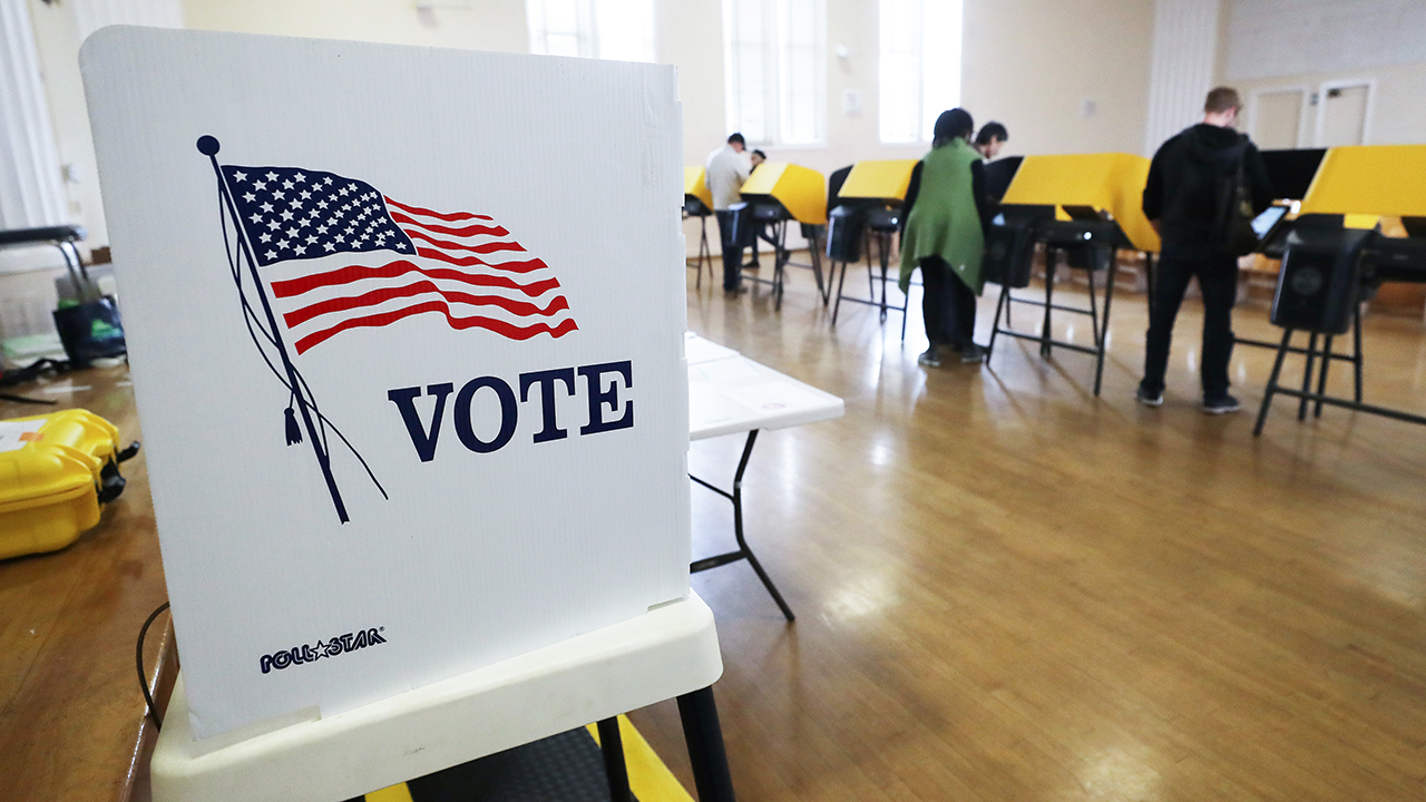 California is home to more immigrant eligible voters than any other state. Above, voters in Los Angeles prepare their ballots on March 1 during early voting for the presidential primary. (Mario Tama/Getty Images)