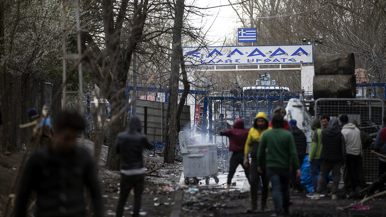 Asylum seekers in Turkey's Edirne Province wait at the country's border with Greece on March 8. (Gokhan Balci/Anadolu Agency via Getty Images)