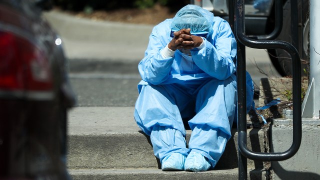 A health care worker outside Brooklyn Hospital Center in New York in early April. (Tayfun Coskun/Anadolu Agency via Getty Images)