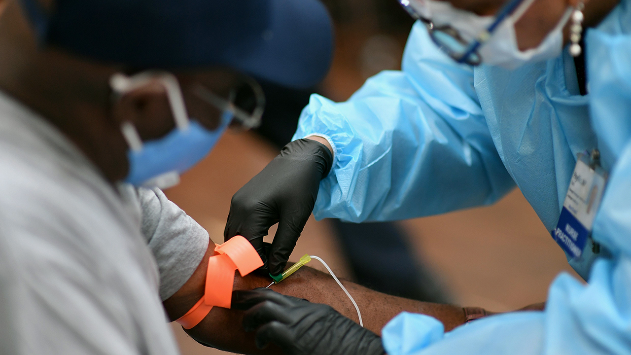 A registered nurse draws blood to test for COVID-19 antibodies at Abyssinian Baptist Church in New York City on May 14, 2020.(ANGELA WEISS/AFP via Getty Images)