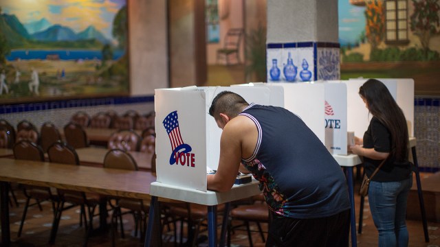 Latinos vote at a polling station in Los Angeles. (David McNew/Getty Images)