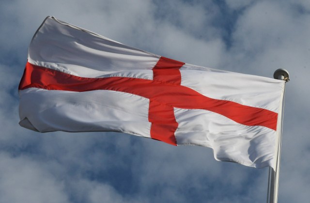 A St. George’s Cross flag flies over No. 10 Downing St. in London in July 2018. Some focus group participants identified the flag with English pride, while others saw it as a symbol of racism and right-wing, exclusionary nationalism. (Steve Back/Getty Images)