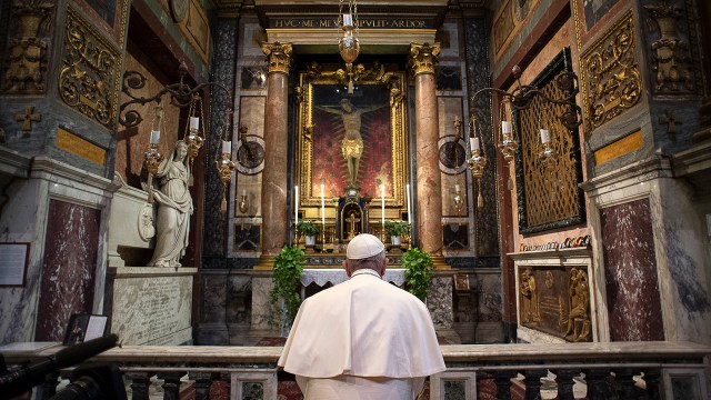 Pope Francis prays at San Marcello al Corso Church in Rome. (Vatican Media/AFP via Getty Images)