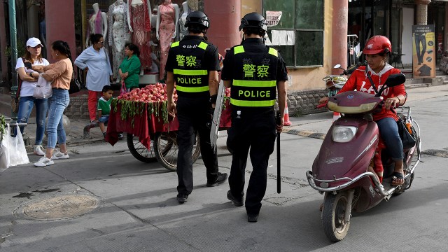 Police officers patrol Kashgar, China, in the western Xinjiang region on June 4, 2019, following the destruction of mosques at the end of Ramadan. 