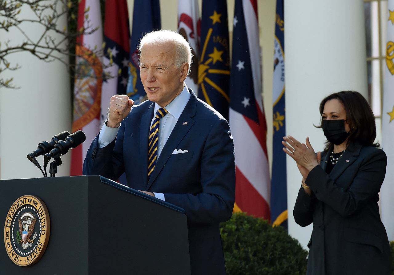 President Joe Biden speaks to reporters in the White House Rose Garden in March 2021, a day after signing the $1.9 billion American Rescue Plan into law. An April survey found two-thirds of U.S. adults approved of the economic aid package.