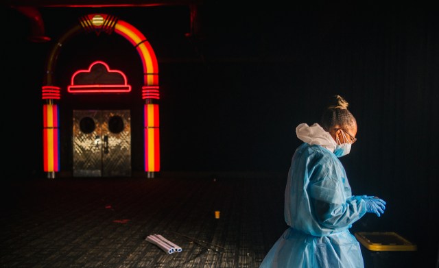 A medical assistant walks out of a Dave & Buster’s-turned-COVID-19 testing facility in Houston on Jan. 8, 2022.