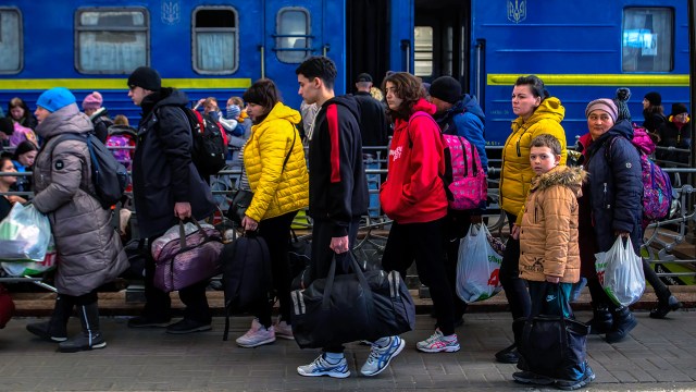 Crowds of refugees from Mariupol, Ukraine, make their way out of the Lviv train station on March 24.