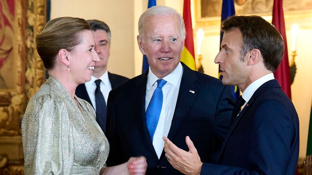 Danish Prime Minister Mette Frederiksen, U.S. President Joe Biden and French President Emmanuel Macron attend a dinner on June 28, 2022, during the NATO Summit in Madrid.