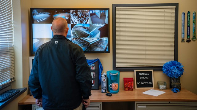 A superintendent monitors newly installed security cameras in October 2018 at Freeman High School, which experienced a school shooting the previous year, in Rockford, Washington.