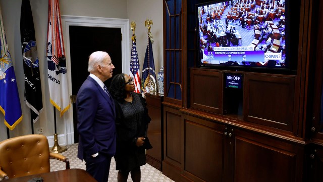 President Joe Biden and then-Judge Ketanji Brown Jackson watch from the White House as the Senate votes to confirm her to the Supreme Court on April 7, 2022. Jackson is the first-ever Black woman to serve on the high court.
