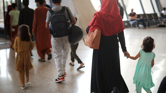 Refugees arrive at Dulles International Airport in Virginia after being evacuated from Kabul, Afghanistan, following the Taliban takeover of the country in August 2021.