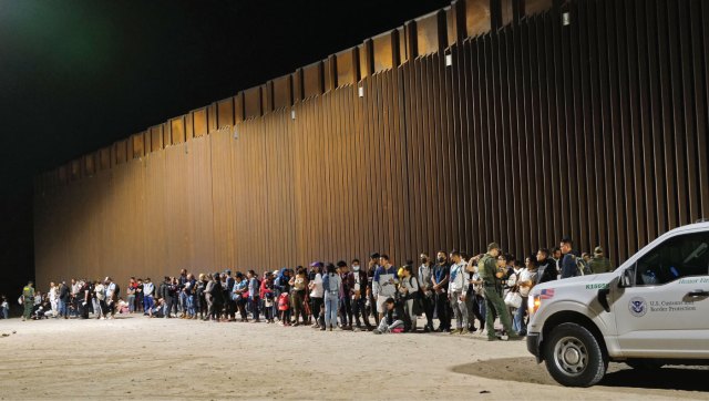 U.S. Customs and Border Protection agents detain migrants attempting to cross into the U.S. from Mexico on Aug. 20 in San Luis, Arizona.