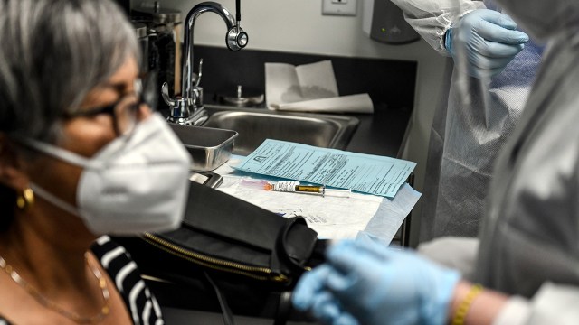 A participant in a phase three clinical trial receives a COVID-19 vaccine at the Research Centers of America in Hollywood, Florida, in August 2020.