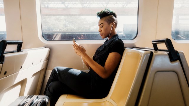 Young Black businesswoman using her cellphone.