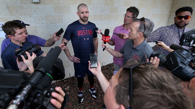 Reporters interview Boston Red Sox pitcher James Paxton at Fenway South in Fort Myers, Florida, on Feb. 16, 2023. (Jim Davis/The Boston Globe via Getty Images)