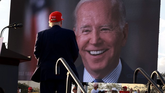 Former President Donald Trump watches a video of President Joe Biden during a rally for Republican Sen. Marco Rubio at the Miami-Dade County Fair and Exposition on Nov. 6, 2022, in Miami. (Joe Raedle/Getty Images)